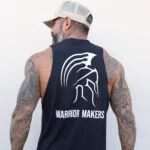 Back view of a man wearing a cream Warrior Makers foam trucker hat with the black sleeveless Warrior Makers t-shirt
