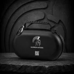 Black Warrior Makers peptide travel case with carry handle and Spartan helmet logo on a stone surface in front of a dark Spartan helmet backdrop