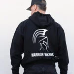 Back view of the black Warrior Makers zip hoodie worn with the hood down, showing the full back print