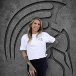 Woman wearing the white Warrior Makers PEPTIDES t-shirt in a cropped fit, front view with Spartan helmet chest logo