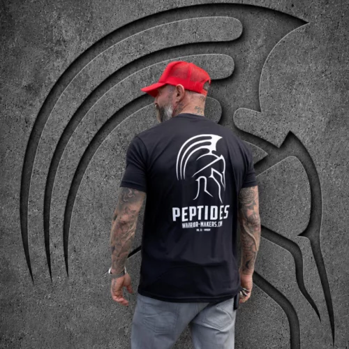 Back view of a man in a red cap wearing the black Warrior Makers PEPTIDES t-shirt with the large Spartan helmet and PEPTIDES back print
